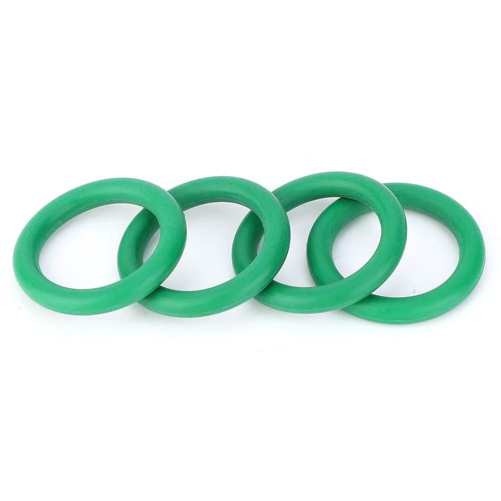 Four green O-rings from the High Temperature Nitrile O Ring Seal Kit 270 Piece Set With Durable Storage Box For Home Hydraulic Industrial And Pneumatic Systems Includes Multiple Sizes And Double Seal To Prevent Water Leaks