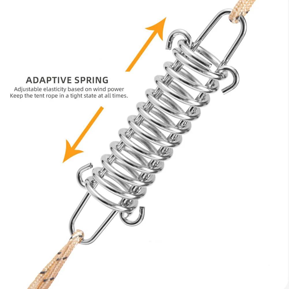 Close-up of Heavy Duty 10 Pack 304 Stainless Steel Tent Springs for Windproof Tarp Awning Sun Shade Rope Tension Dog Chain Porch Swing and Outdoor Shelter Stabilization with text "Adaptive Spring" and arrows indicating tension adjustment.
