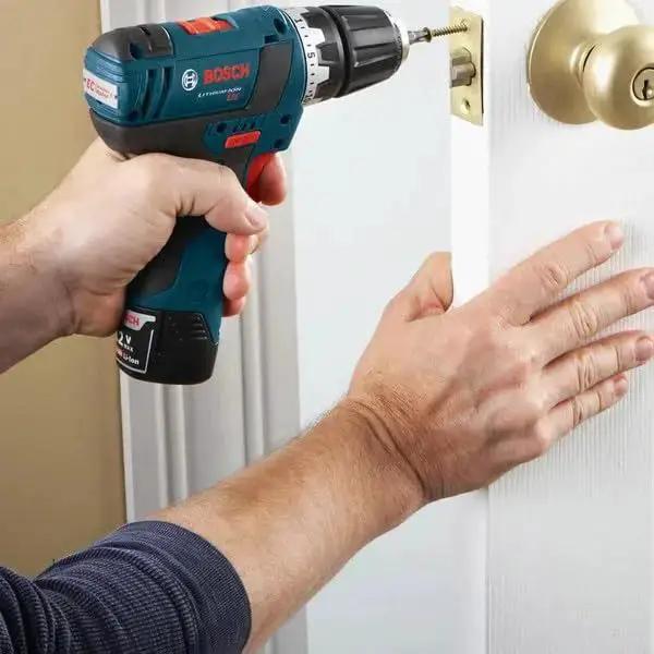 Using the 91 Piece Drilling And Driving Mixed Bit Set For Wood Metal And Masonry By Bosch with driver bits in a door lock.