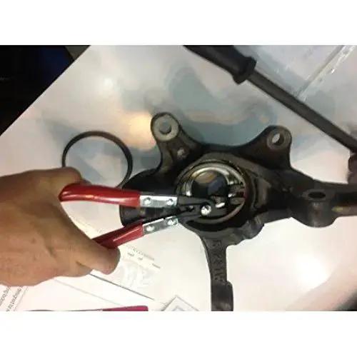 Using Wheel Bearing Lock Ring Pliers For Toyota Vehicles With Special Angled Tips and Comfort Grip Handles on wheel hub