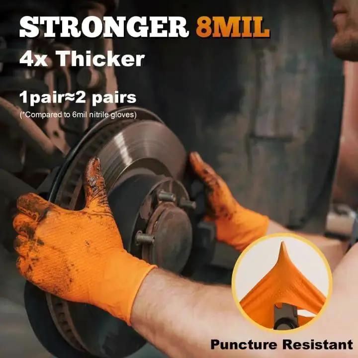 Mechanic wearing Heavy Duty Orange Nitrile Gloves 8 Mil Diamond Texture Grip XL 100 Count during car maintenance