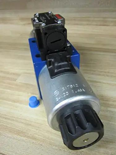 Close-up of Hydraulic Solenoid Directional Control Valve 4WE10D40/OFCG24N9DK24L with 24VDC coil and 4-pin connector on a wood surface.