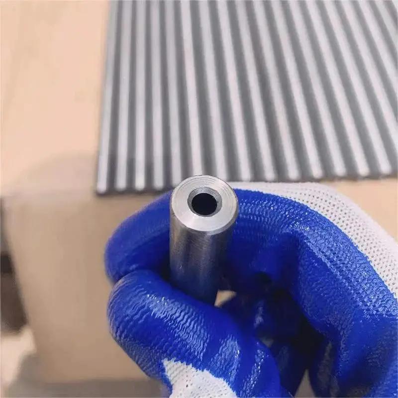 Close-up of 4140 Chromoly Steel Hydraulic Tubing 22mm Outer Diameter Seamless Pipe in gloved hand, showcasing 3mm wall and finish.