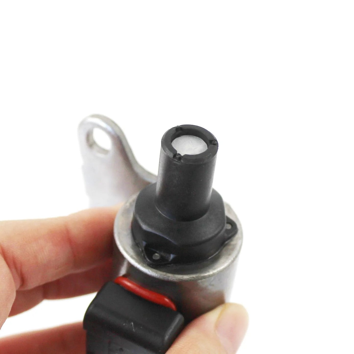 Close-up of Top Notch JF010E CVT Stepper Motor Replacement For Nissan Altima Maxima Murano Versa, held by hand.