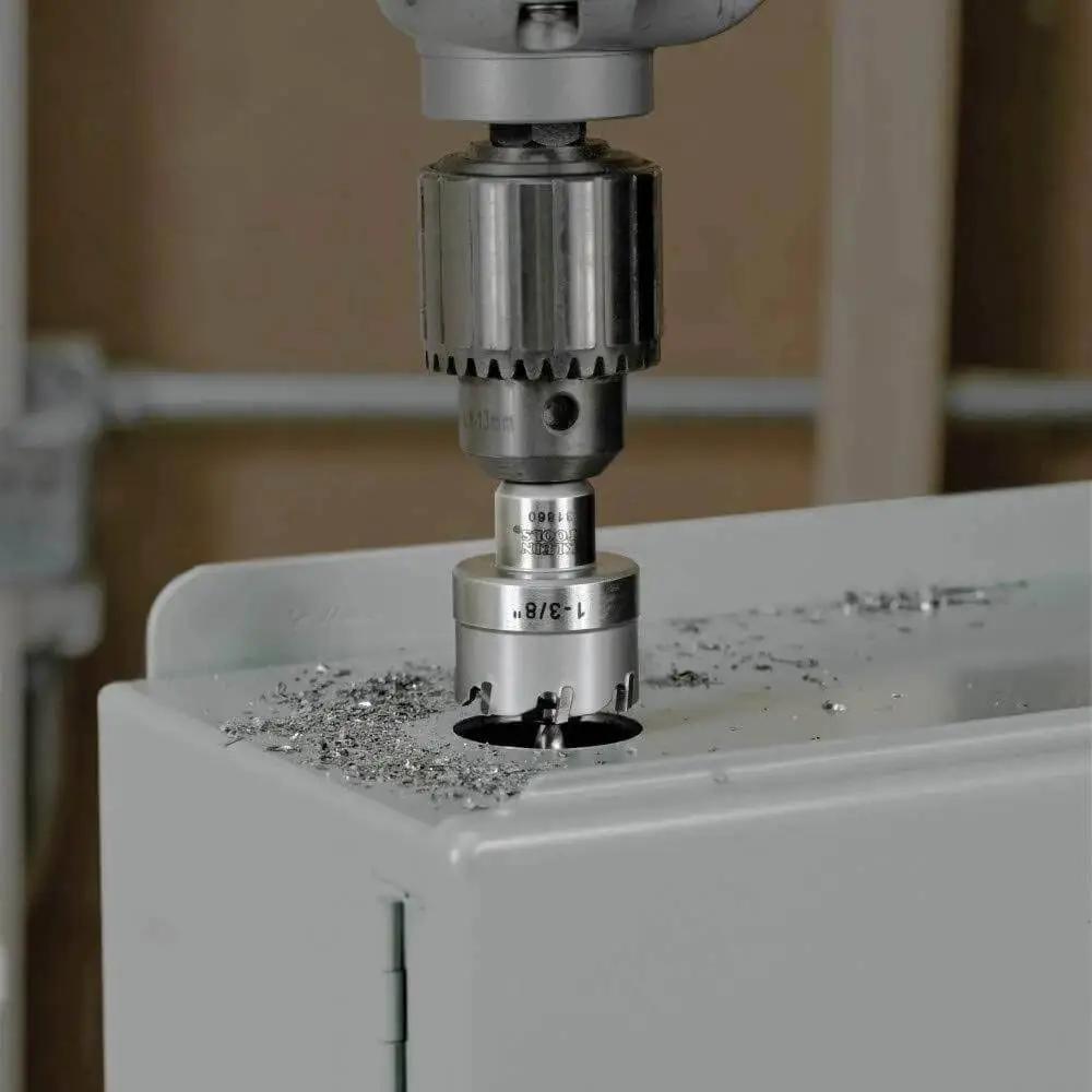 Heavy Duty Beast Carbide Hole Saw Kit With Pilot Bit In Rust Proof Molded Plastic Case Includes Three Hole Saws 7/8 Inch 1-1/8 Inch 1-3/8 Inch Plus One More Size For Quick Precise Drilling In Stainless Steel Mild Steel Iron Copper And Brass during use