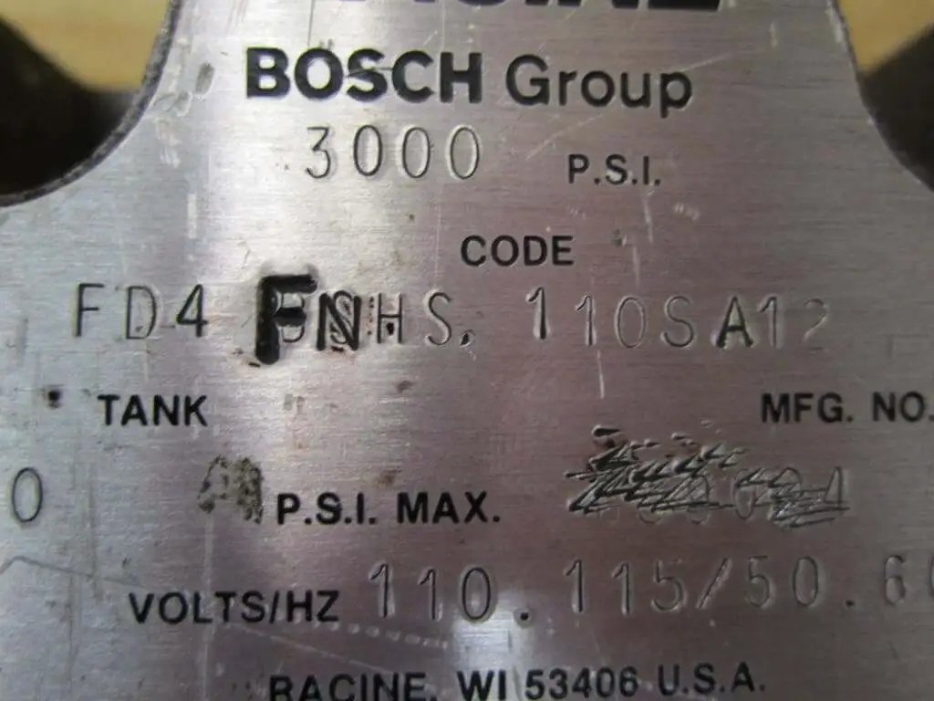 Close-up of FD4-FNHS-110SA12 Industrial Hydraulic Solenoid Valve label, showing 110/115V 50/60Hz, 3000 PSI, Racine USA details.