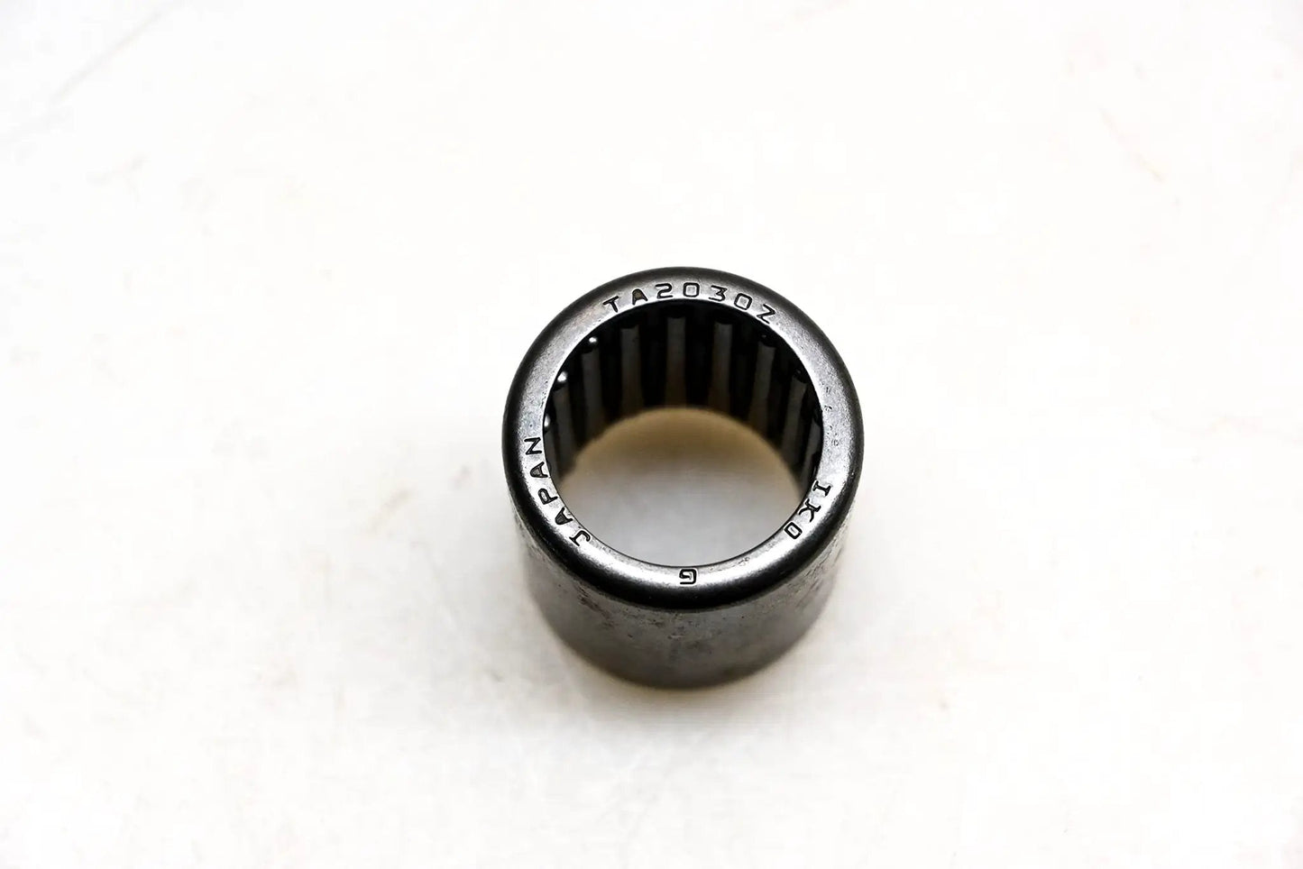 IKO TA2030Z Shell Type Needle Roller Bearing 20x26x30mm, drawn cup design, showing top view of high load capacity bearing