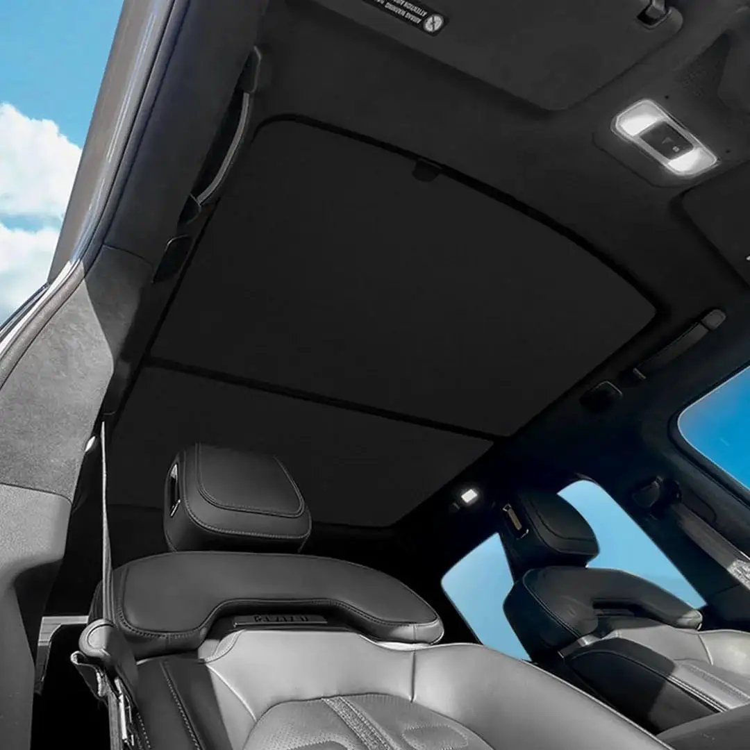Interior view of Rivian R1S with R1S Roof Sunshade Two Piece Full Blackout installed, showing blackout coverage on roof glass.