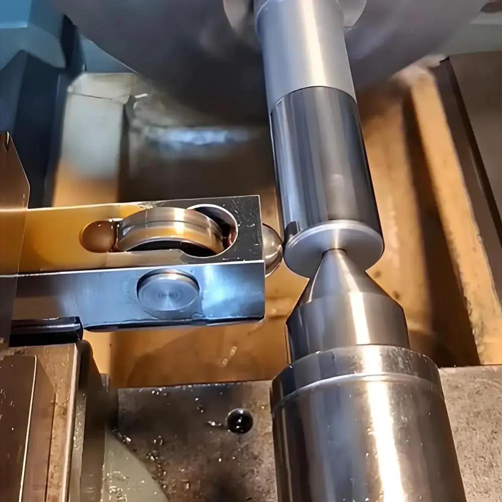 Mini Lathe Burnishing Tool For Smoother Surface Finish And Mirrorlike Shine During Turning No Grinding Needed High Hardness Bearing Steel Balls Deliver Superior Wear Resistance And Precision For Consistent Flawless Results in use on lathe machine, showing mirror finish on metal.