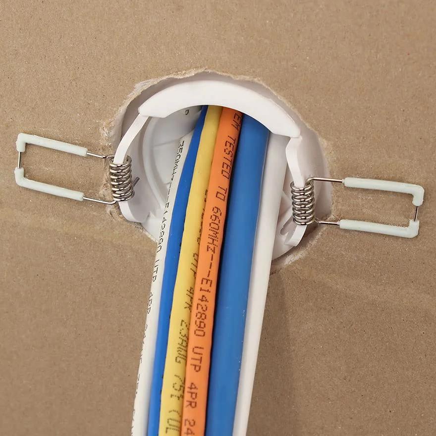 White Two Inch Cable Pass Through Port Pair With Spring-Lock, Durable Plastic Rubber Construction For Clean Cable Management, Requires Two And A Half Inch Hole, Inner Diameter Two Inches, Pack Of Two, installed in wall with cables