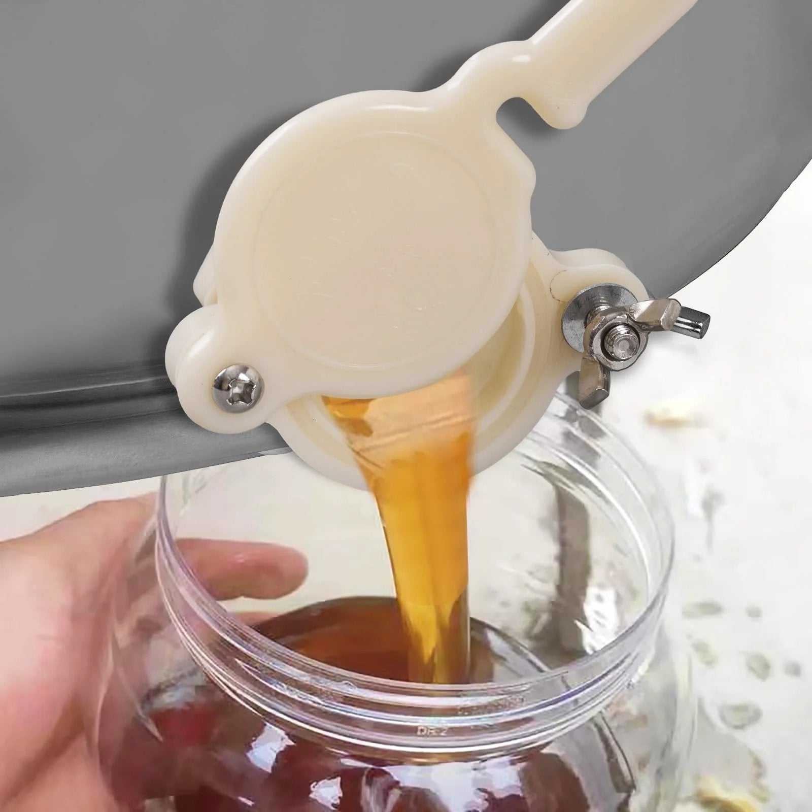 Beekeeping Honey Gate Valve 3 Pack For 5 Gallon Buckets Food Grade Nylon Beehive Gate in use with honey flowing into a jar