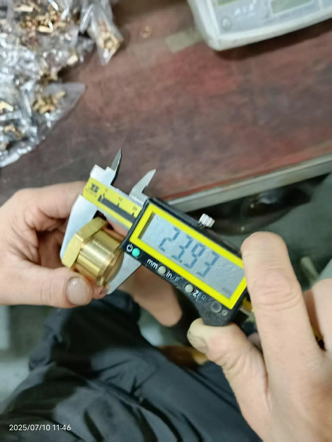 Measuring Three Quarter Inch NPT Female Brass Pipe Cap Hex Head Fitting with calipers showing durable brass construction.