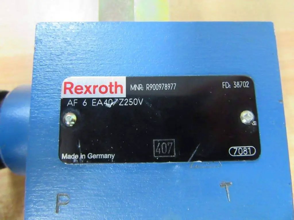 Close-up of Bosch Rexroth R900978977 AF6EA40Z250V hydraulic valve label on blue housing.