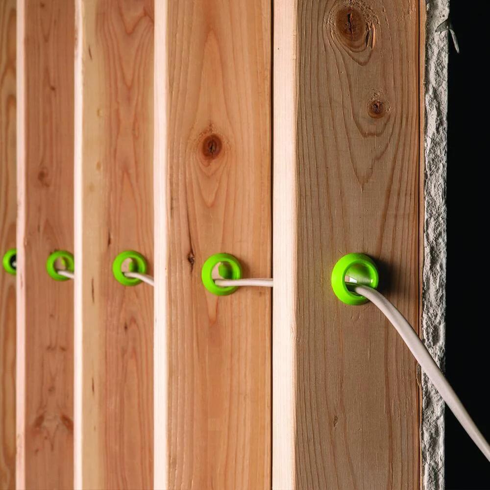 Stud Electrical Wire Protector 5 Pack for DIYers by EZ Guard showing installed protectors in stud walls with cables.