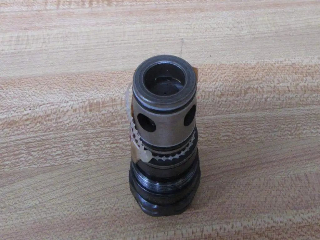 Single pilot-operated pressure relief valve DB20K2-12/100XYV 100 bar hydraulic safety regulator on wooden surface