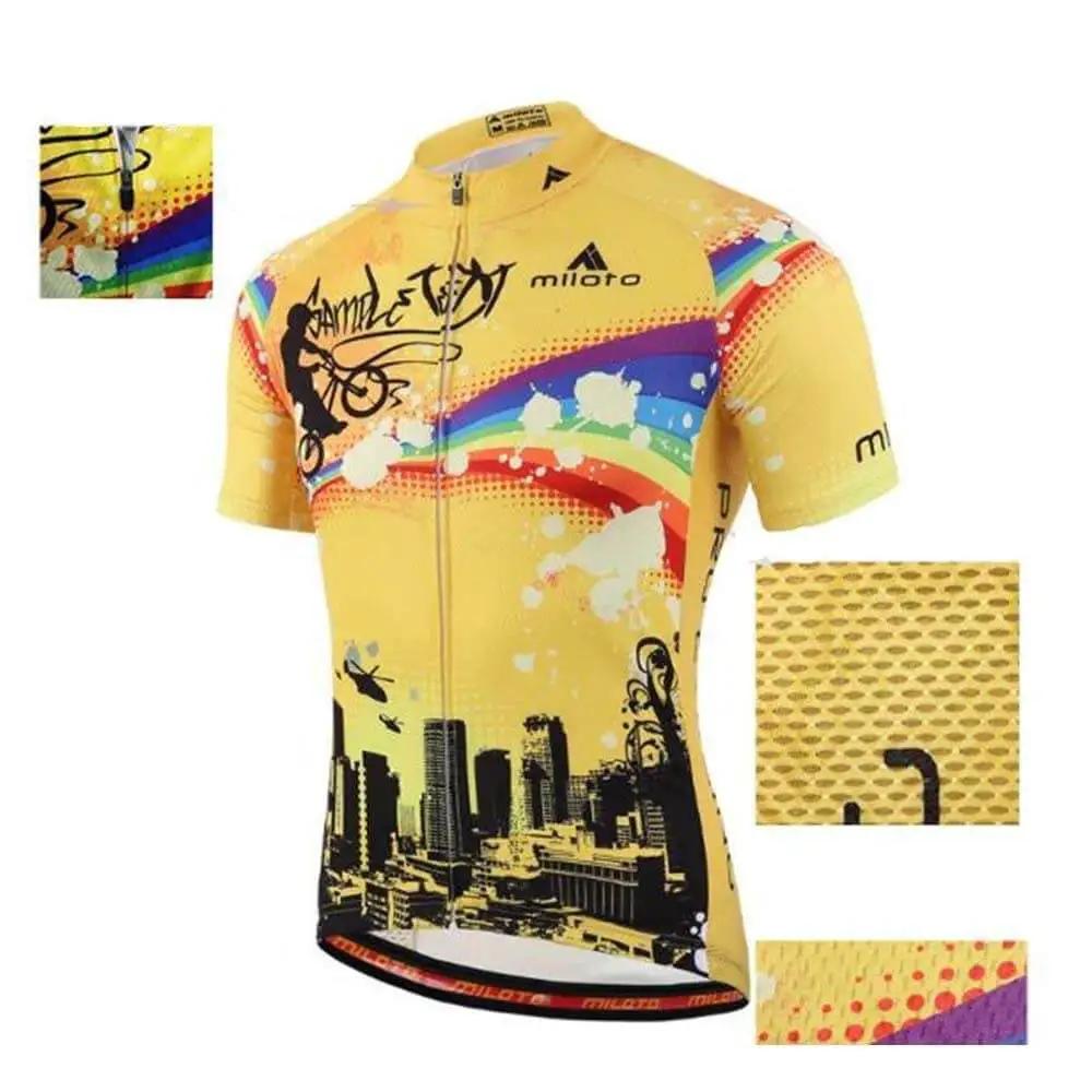 Yellow cycling jersey with city skyline and cyclist design, featuring colorful stripes and breathable fabric detail.