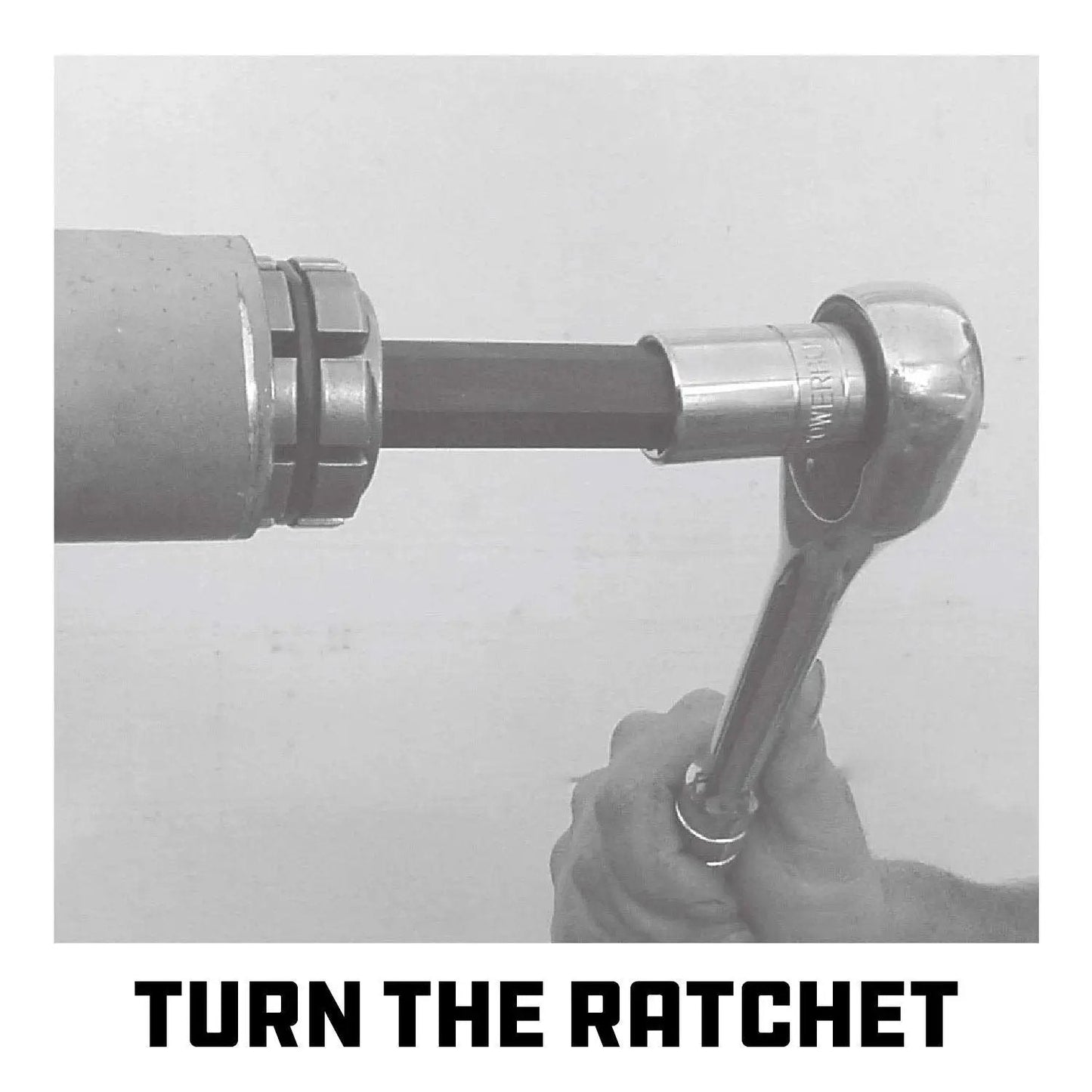 Using a Tailpipe Expander Fits One Eighth To One And Three Quarters Inches Exhaust Pipe with ratchet tool in garage.