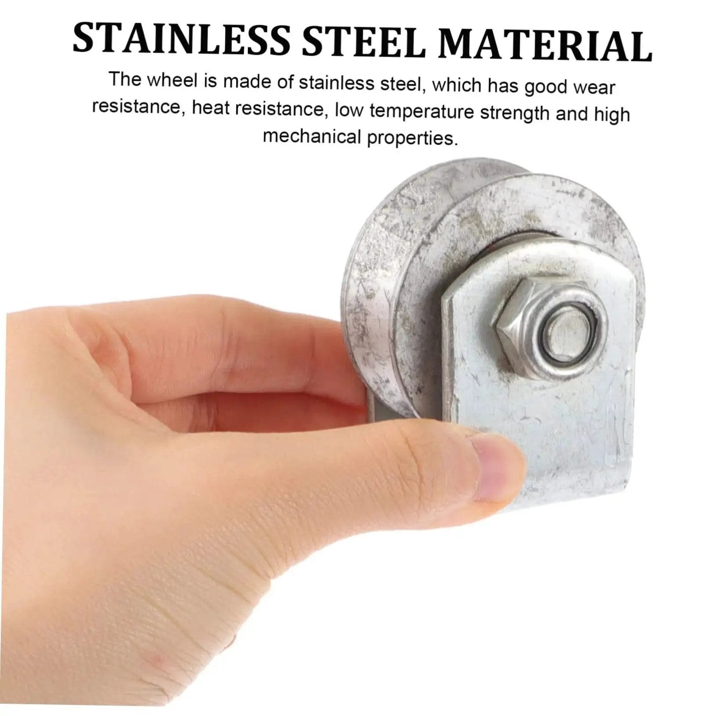 Industrial Cast Iron Groove Wheel Garage Door Roller held in hand, showing stainless steel material detail and embedded bearing.