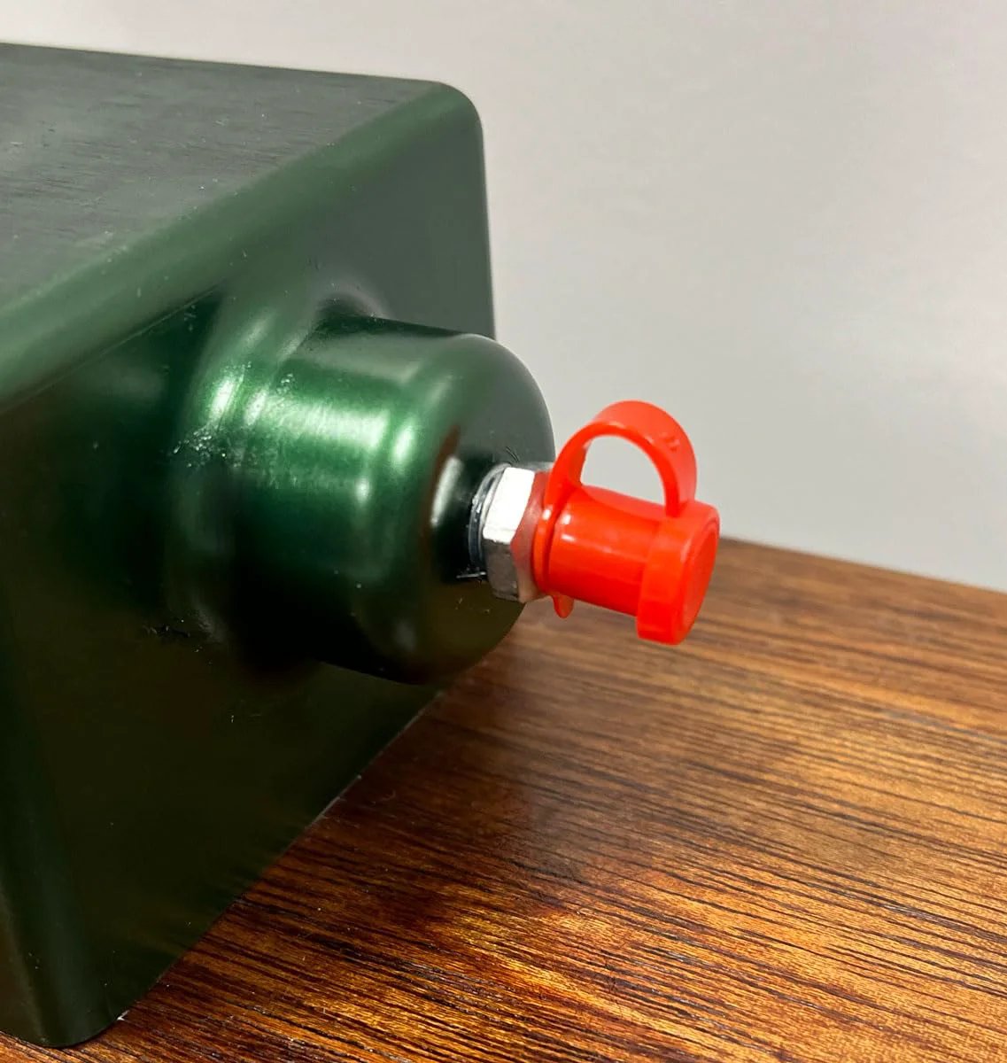 Red 50 Count Grease Fitting Caps With Integrated Collar For All SAE And Metric Fittings By LockNLube 1.67 Inch Overall Length attached on fitting