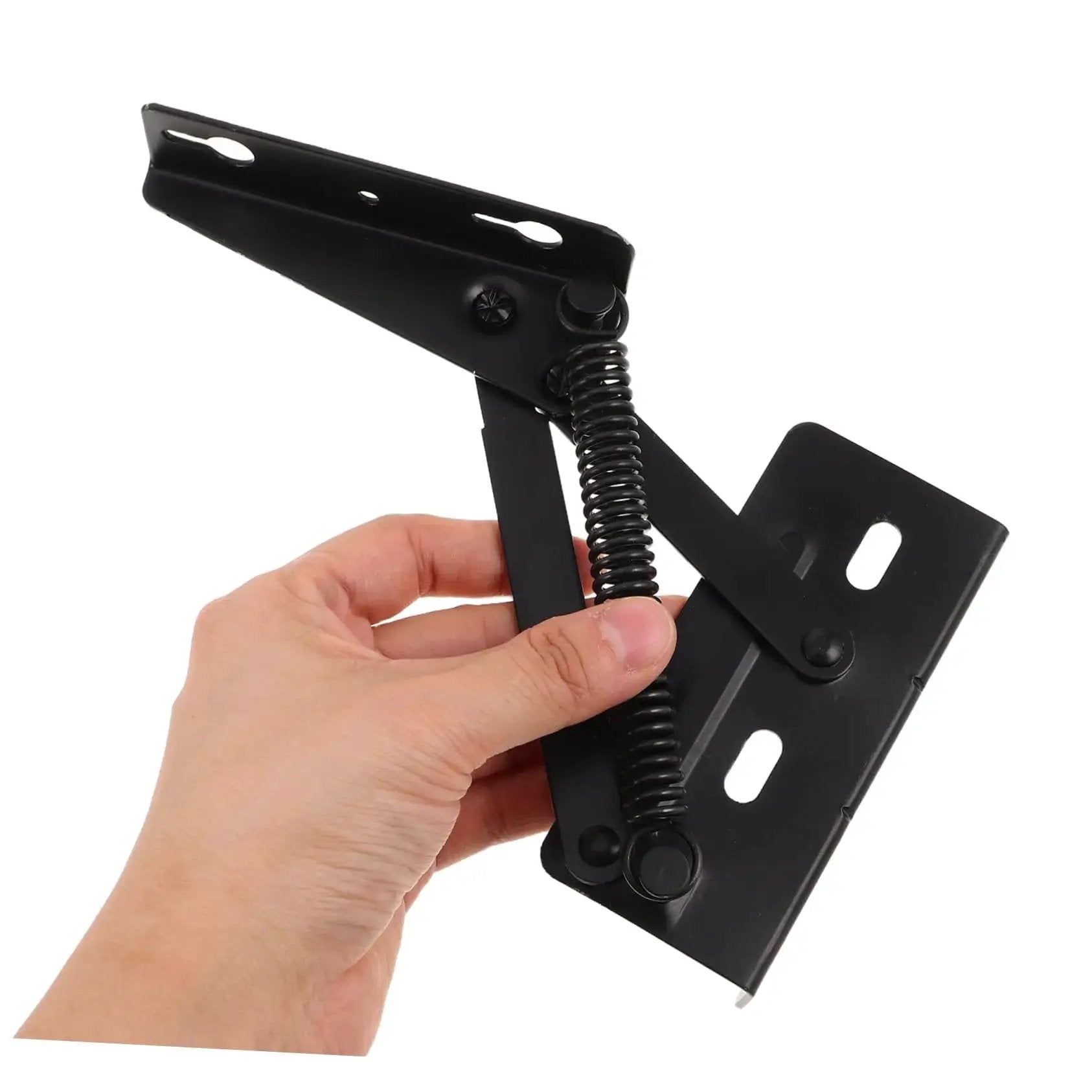 Person holding a folding sofa hinge kit with spring loaded storage brackets for cabinets and furniture in black heavy-duty steel.
