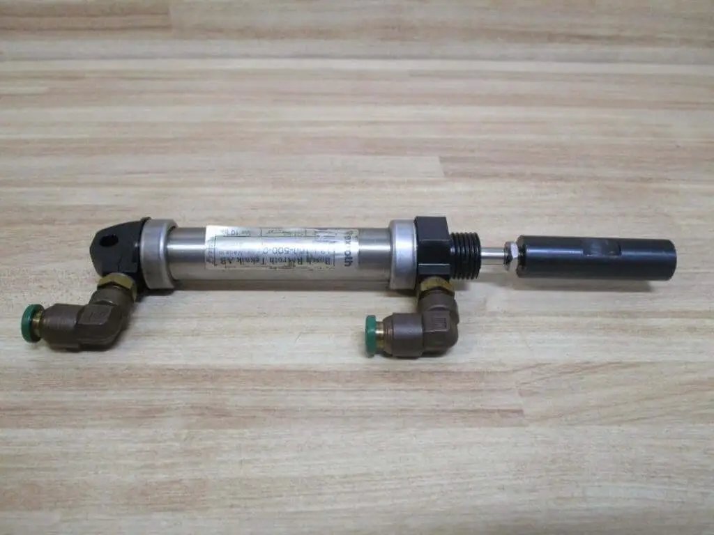 Industrial Hydraulic Cylinder 10mm Bore With Two And One Half Inches Stroke PN 13316050001 on wooden surface