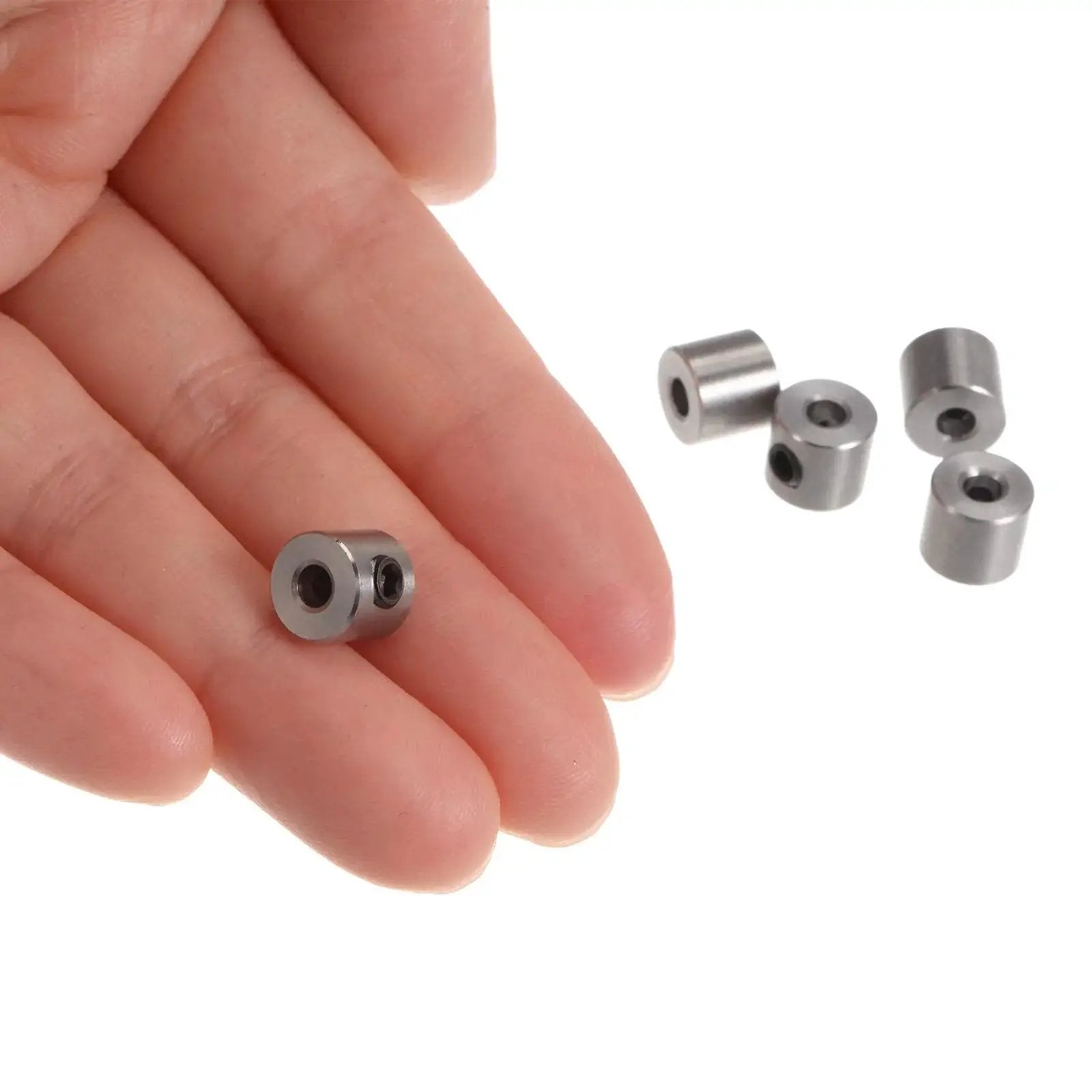 10 Pack 3mm Shaft Collar Set Screws In Stainless Steel 304, 8mm Outside Diameter, 7mm Thick, shown in hand for scale