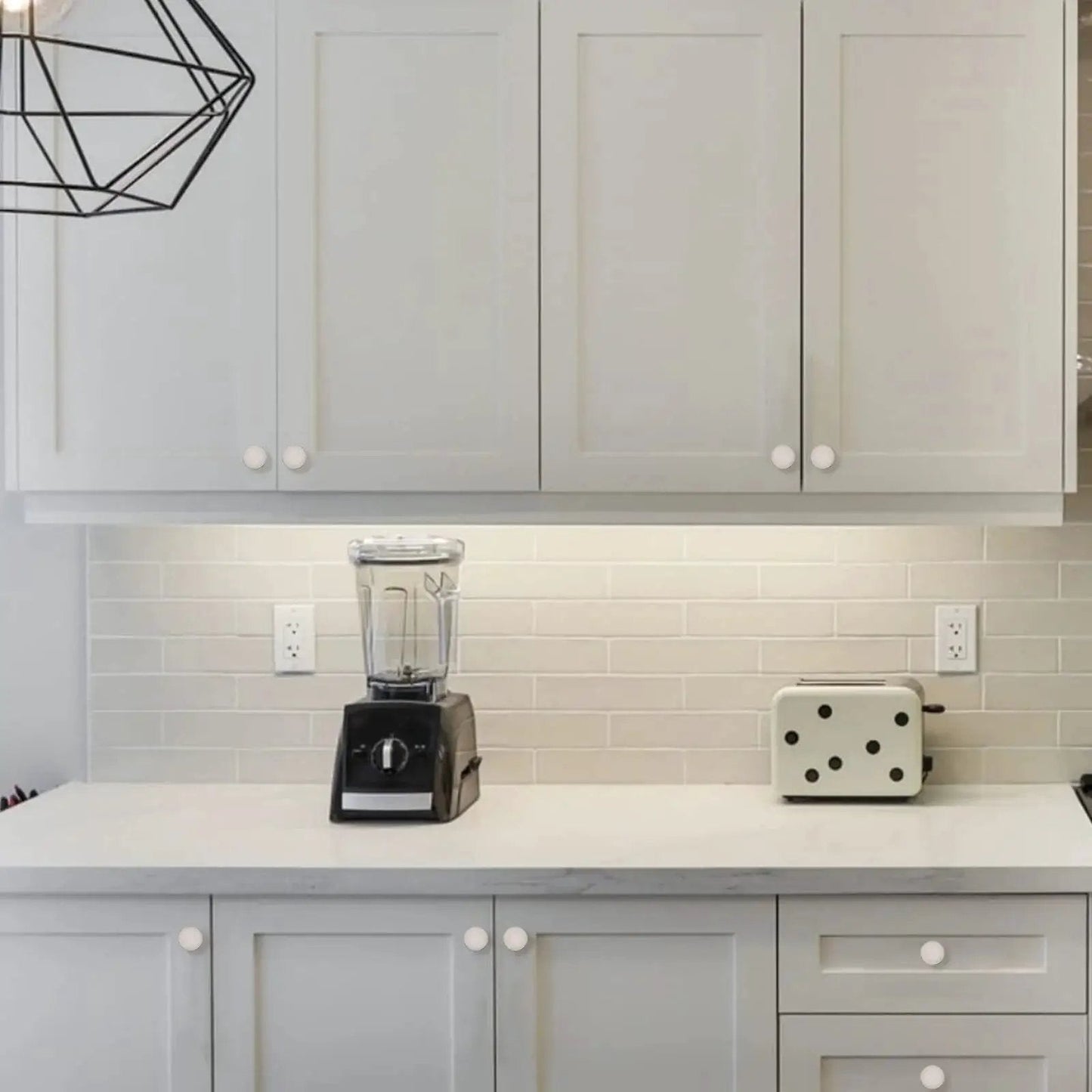 Modern kitchen with white cabinets featuring 10 Pack Brushed Satin Nickel Cabinet Knobs 1.2 Inch Round Drawer Knobs For Cabinets And Drawers.