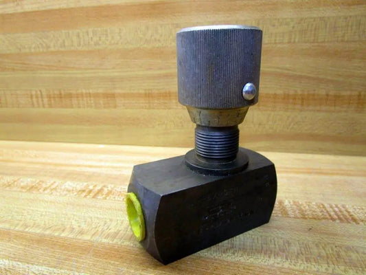 Rexroth Bosch DRV12-1.0/12V Flow Control Valve with 1/2-In NPT Ports on a wooden surface, Model DRV121012V