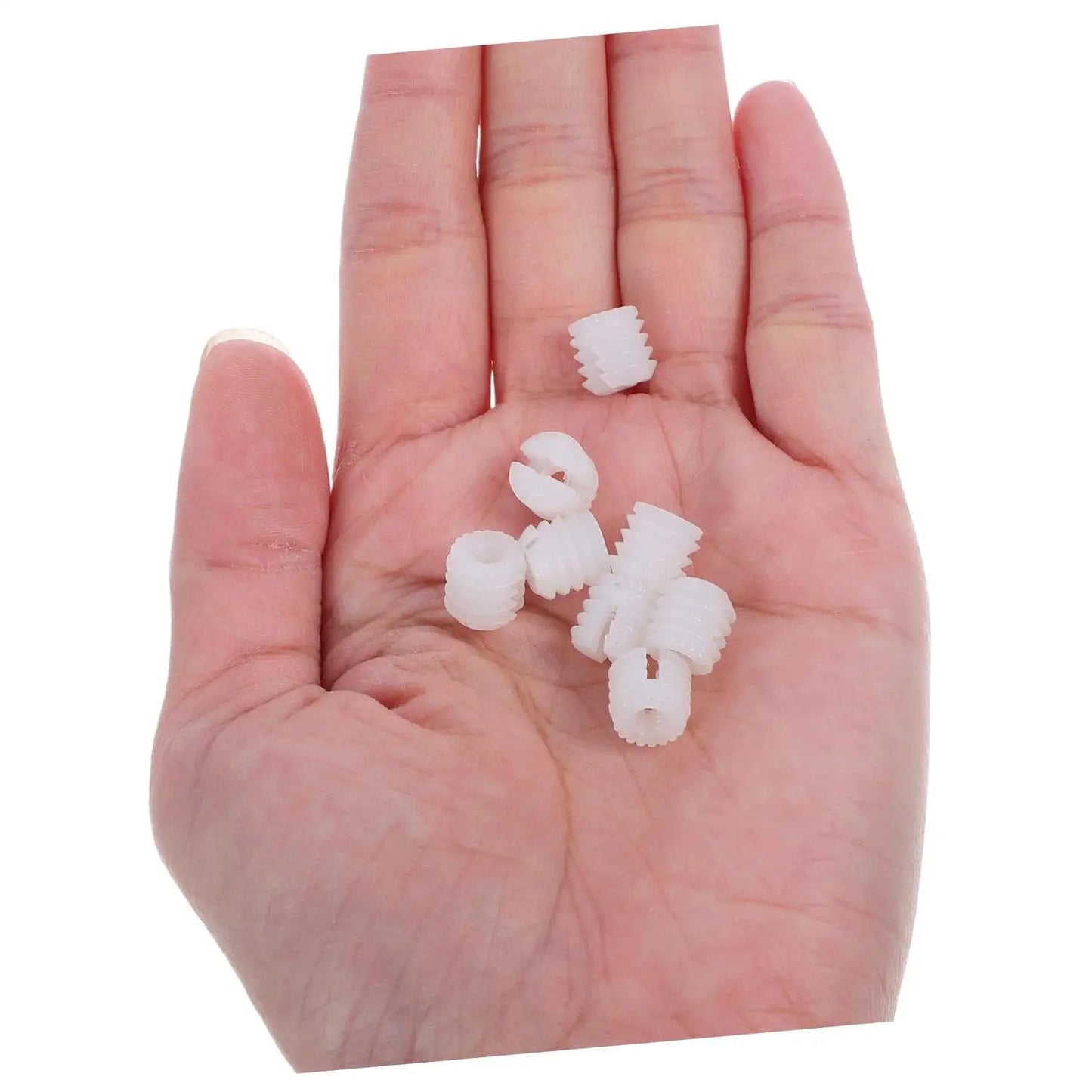 Hand holding nylon hinge dowels from 200 Piece Heavy Duty Hinge Dowels Set For Stable Cabinet Doors And Bathroom Furniture Quick Install Nylon Dowels.