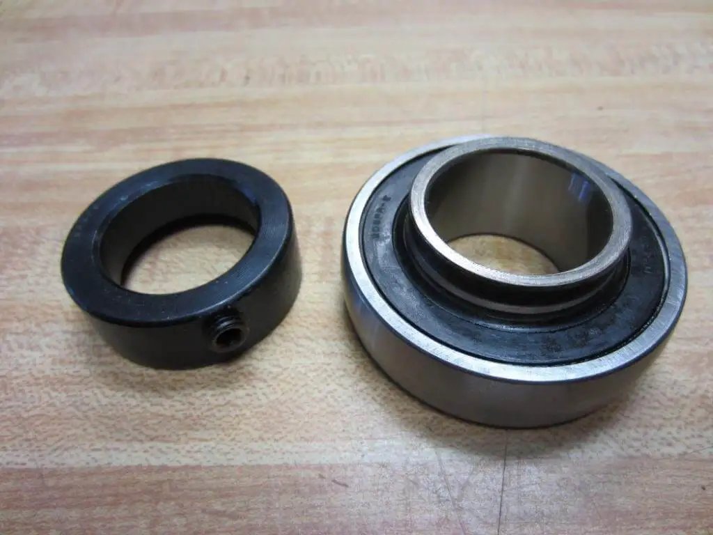 Single KH206-30 Narrow Inner-Ring Eccentric Collar 30 mm bearing insert with locking sleeve on table