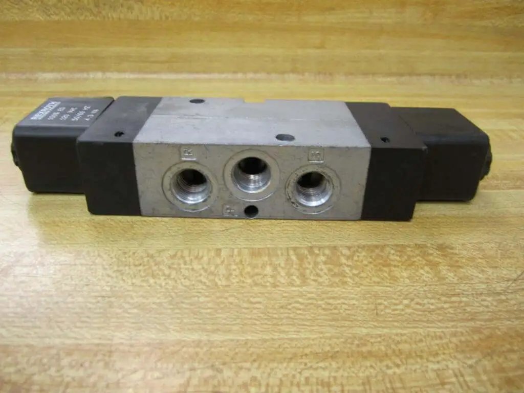 Rexroth Bosch Group 0-1313 Solenoid Valve Quarter Inch NPT Thread 120 VAC 50 To 60 Hz 4.3 VA Coil, top view on wooden surface