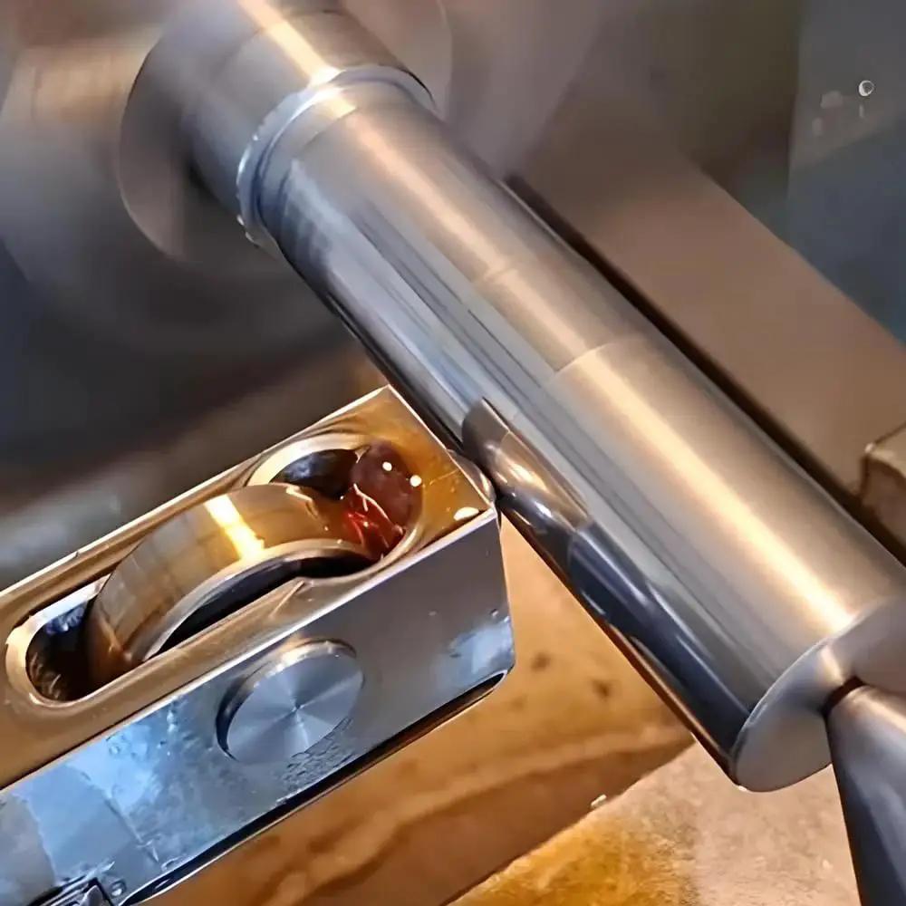 Mini Lathe Burnishing Tool For Smoother Surface Finish And Mirrorlike Shine During Turning No Grinding Needed High Hardness Bearing Steel Balls Deliver Superior Wear Resistance And Precision For Consistent Flawless Results shown in operation on metal surface.