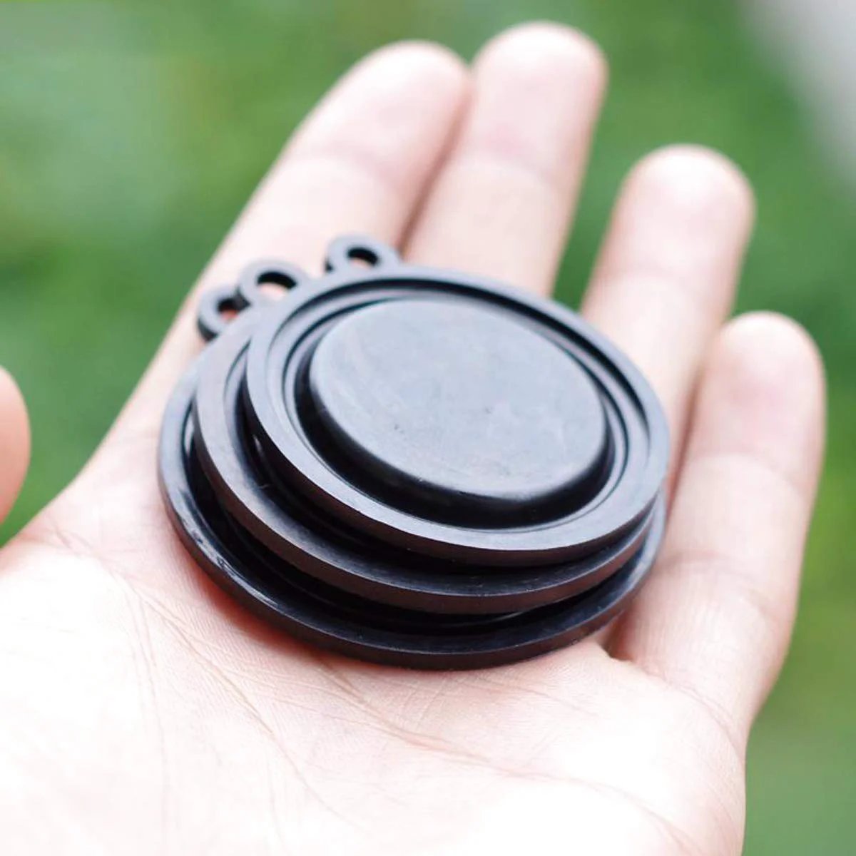 Person holding Water Pressure Diaphragm Kit For 50mm Gas Water Heaters Universal 10 Pack Plastic Diaphragm Accessories