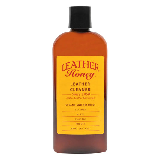 Non Toxic Leather Cleaner For All Leather Goods That Deep Cleans Leather, Faux And Vinyl On Couches, Car Seats, Purses, Shoes And Bags From USA Since 1968 Leather Honey in a 16 oz bottle, brown with yellow label.