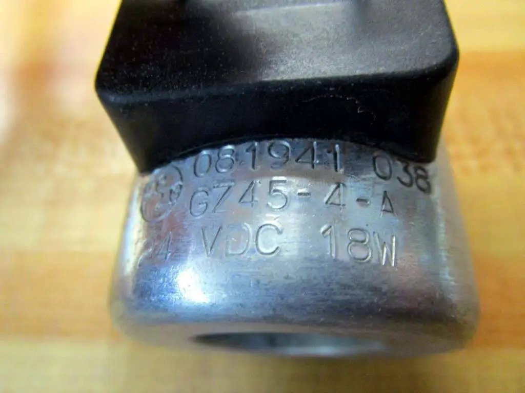 Close-up of 24V DC Solenoid Coil Single Pack G745-4-A (G7454A), metal casing showing specifications: 24V DC, 18W.