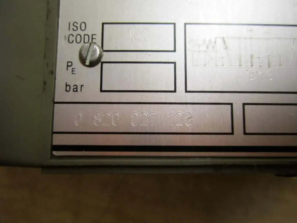 Directional control valve 0 820 027 128 solenoid, housing detail showing part number, for industrial hydraulic systems.