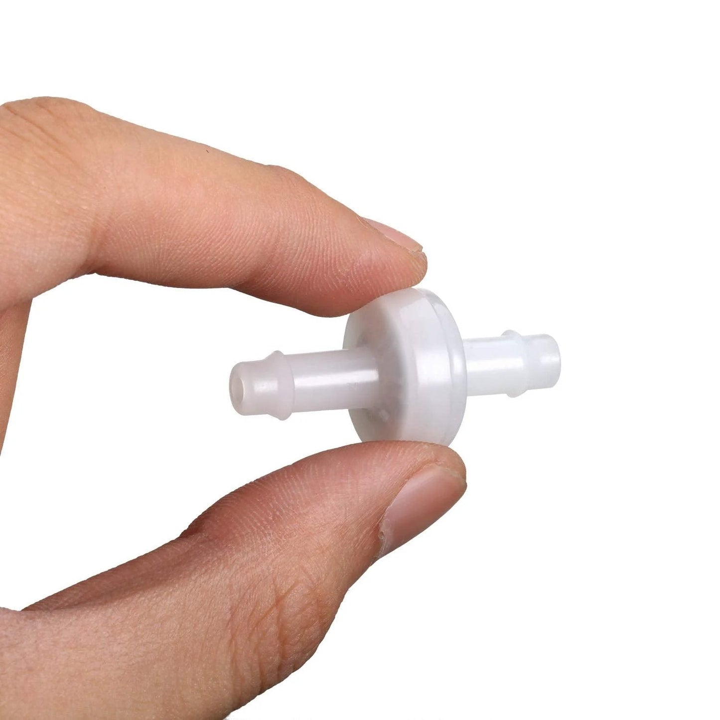 Close-up of a hand holding a small PVDF check valve, 0.25 inch diameter, showing wear-resistant construction for fluid systems.