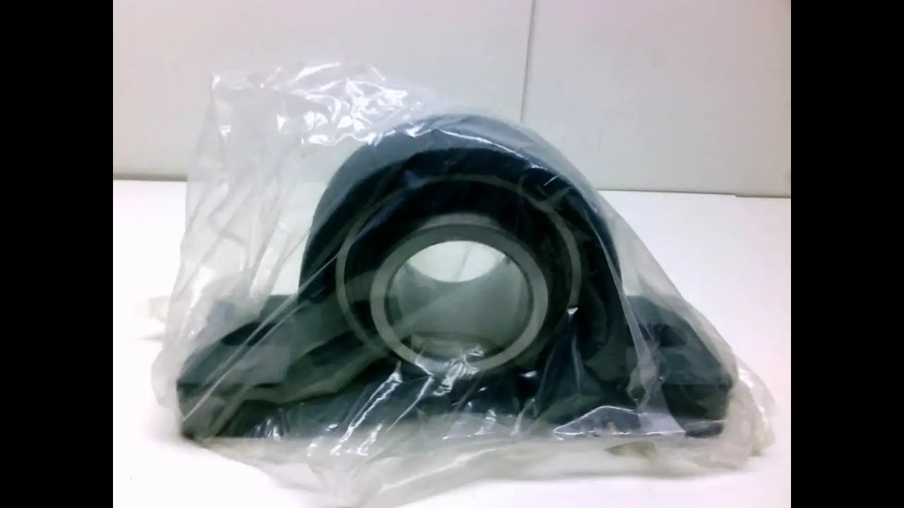 Single UCPX18 pillow block unit, 90 mm bore, 101.6 mm center, 104 mm bearing width, 206 mm overall, cast iron housing, wrapped in plastic