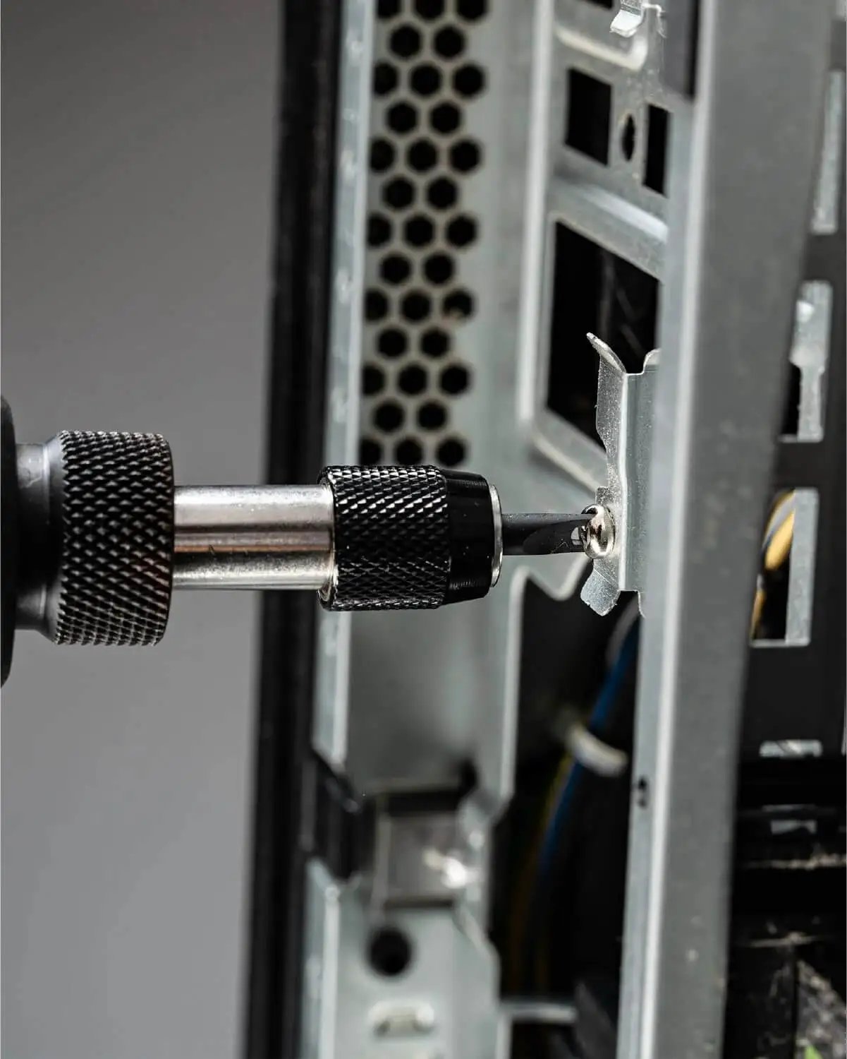 Close-up of a 32 Piece Pro Grade Tamper Proof Security Bit Set With Torx Hex Tri Wing Spanner And Clutch Bits Quick Release Bit Holder One Quarter Inch Adapter For Electric Drills And Impact Drivers in use