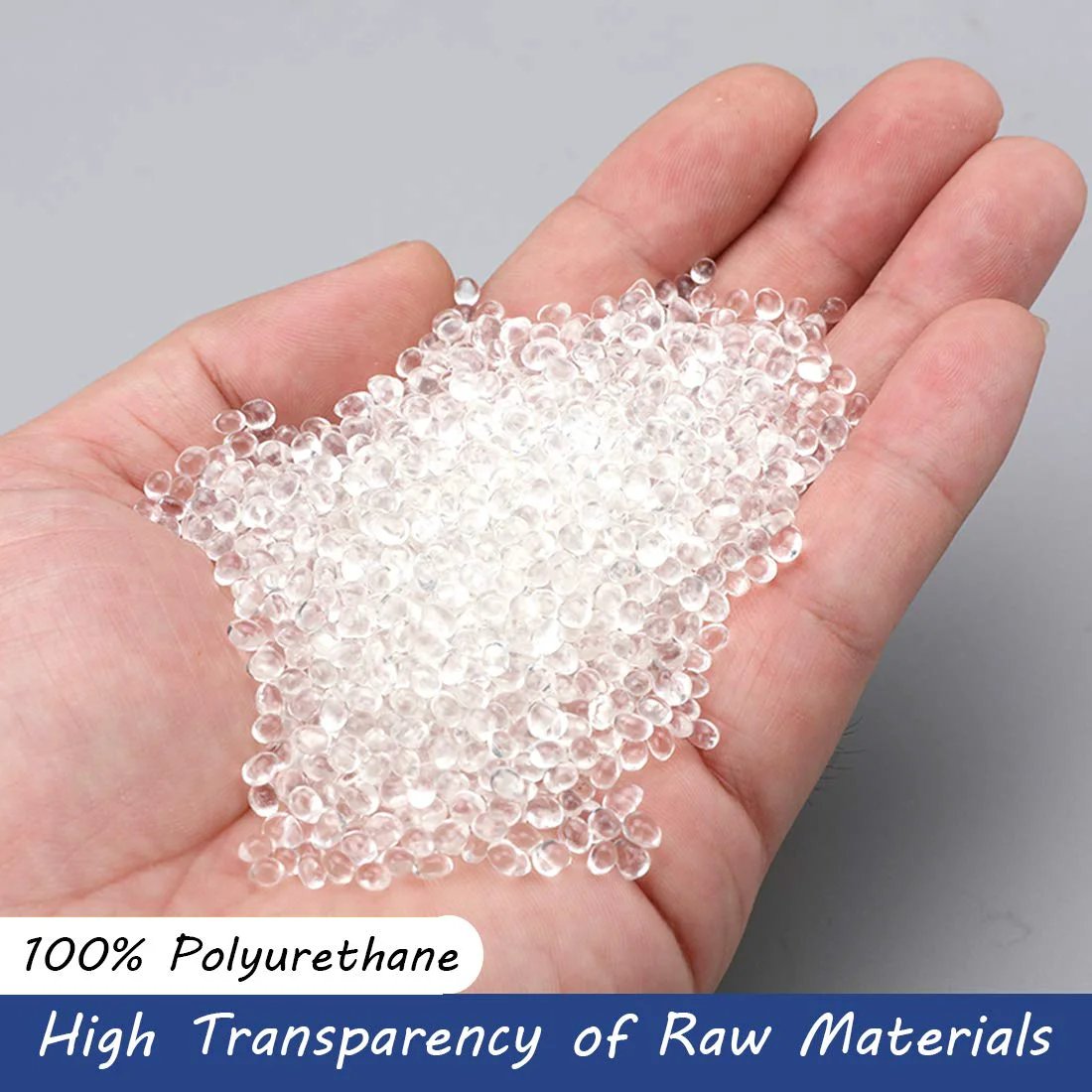 Transparent polyurethane pellets in hand showcasing material for Pneumatic Polyurethane Tubing Three Eighths Inch Outer Diameter.