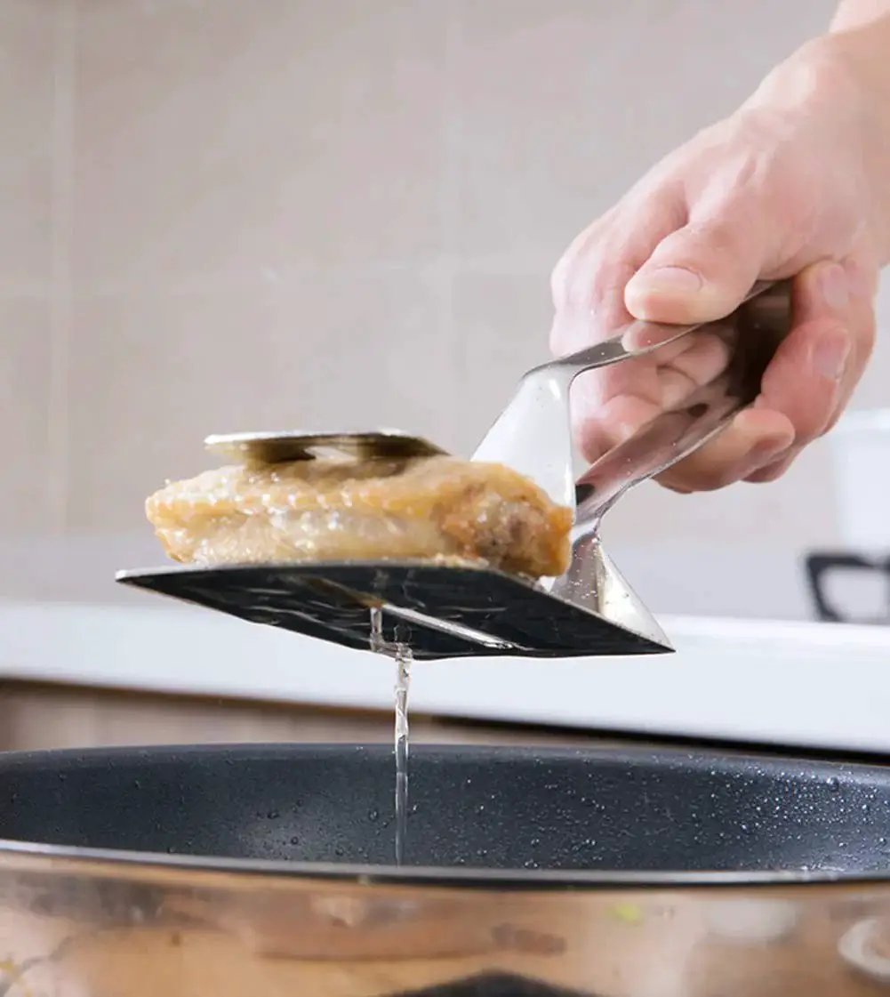 Using Multifunction 11 Inch Premium Stainless Steel Tongs 3 In 1 Gripper Flip And Scraper for frying in kitchen