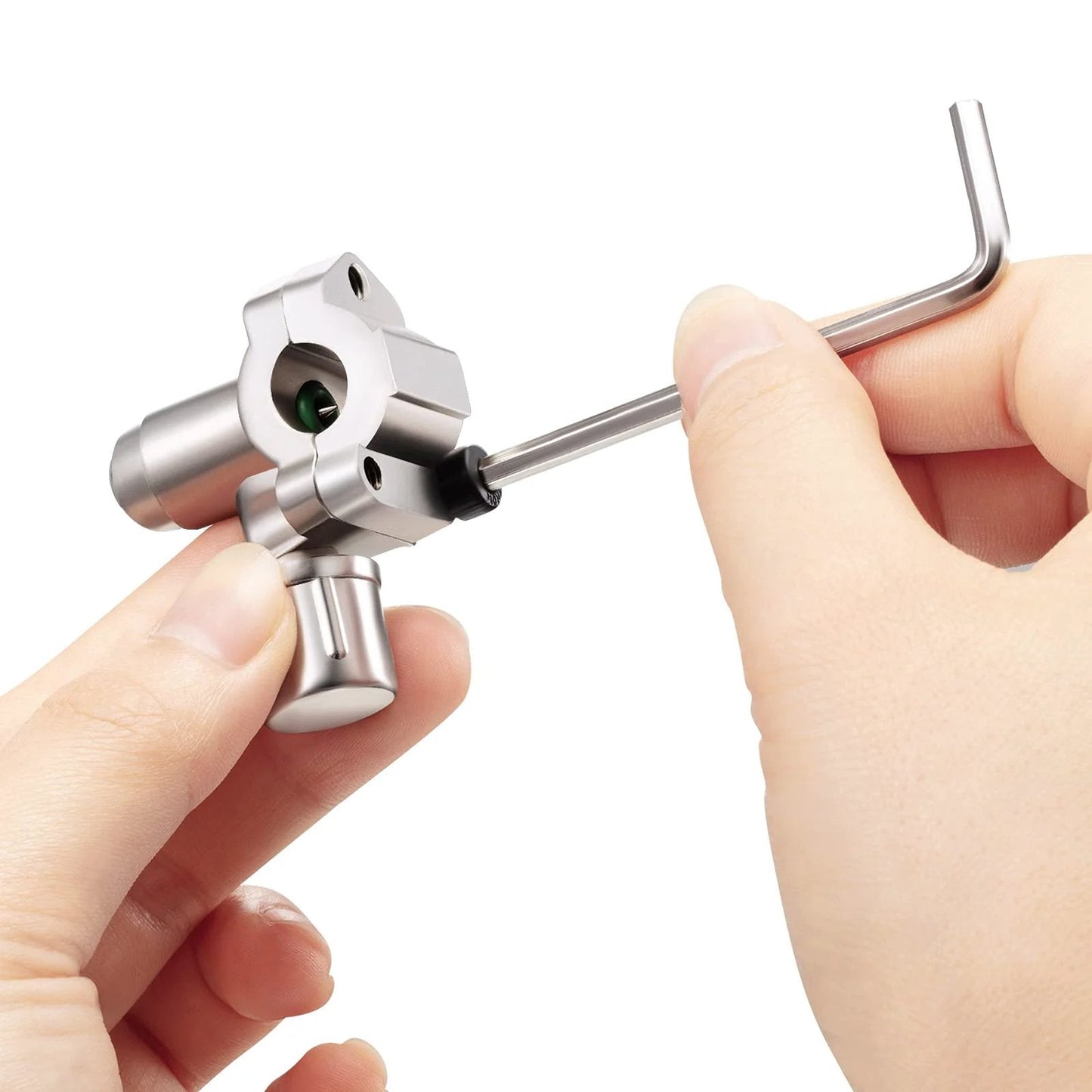 Hands assembling BPV-31 Bullet Piercing Tap Valve Kit For Refrigerator Lines, showing valve and hex key, close-up view.