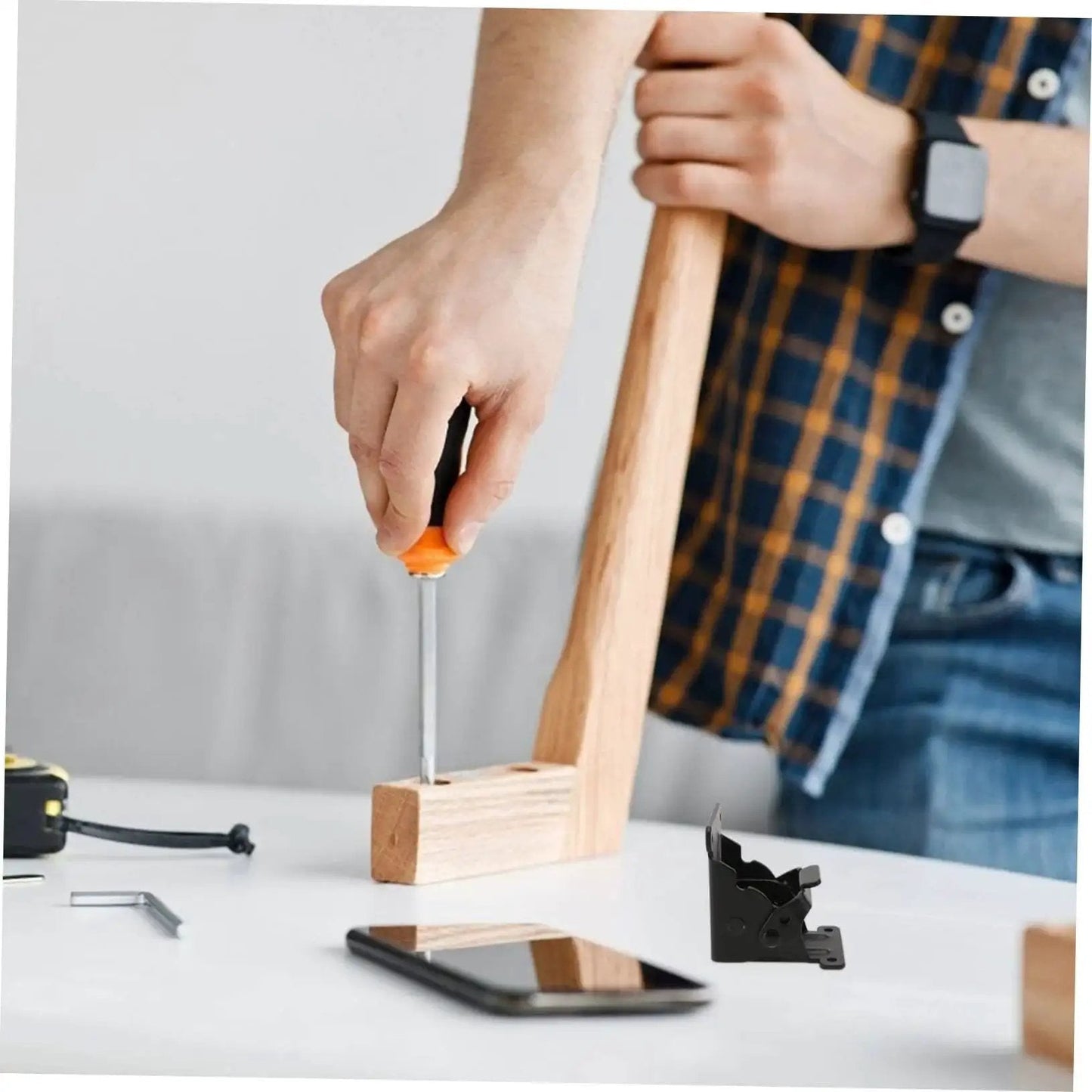 Person assembling furniture using Heavy Duty Folding Hinges for Table Legs and Chairs 2 Pack Spring Hinges Easy to Install.