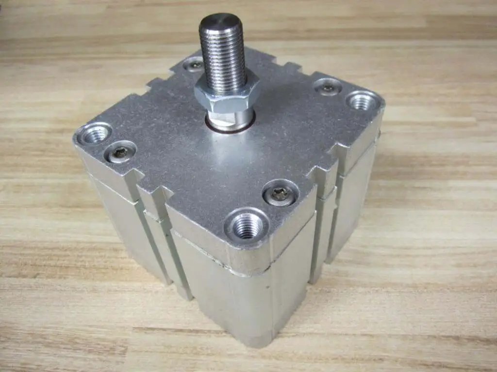 Bosch Rexroth Cylinder 0822-397-205 0822397205 showing NPT thread top view on a wooden surface