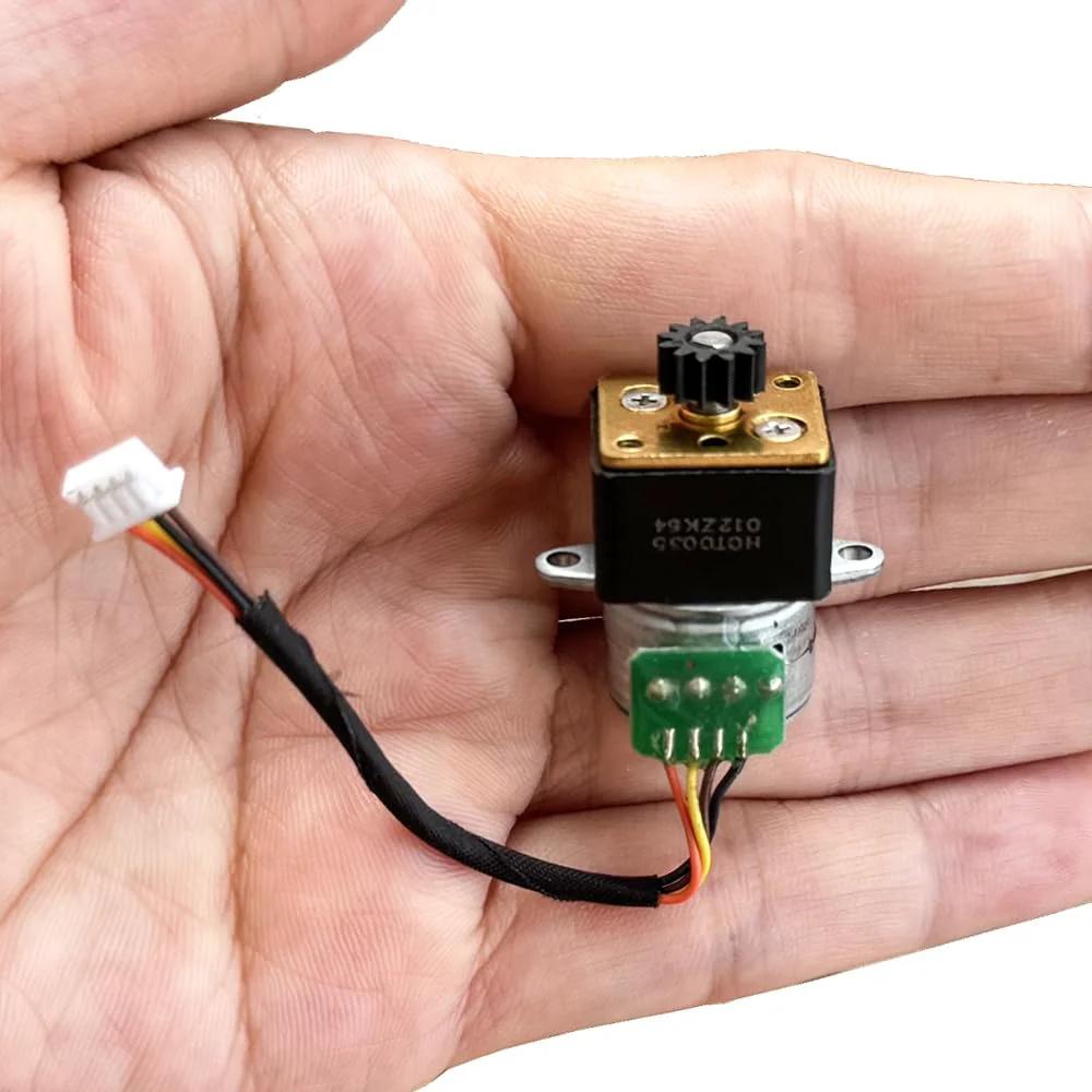 DC 5V 2 Phase 4 Wire Micro Stepper Motor 15mm With Full Metal Gearbox 1 To 35 Reduction, shown in hand for scale