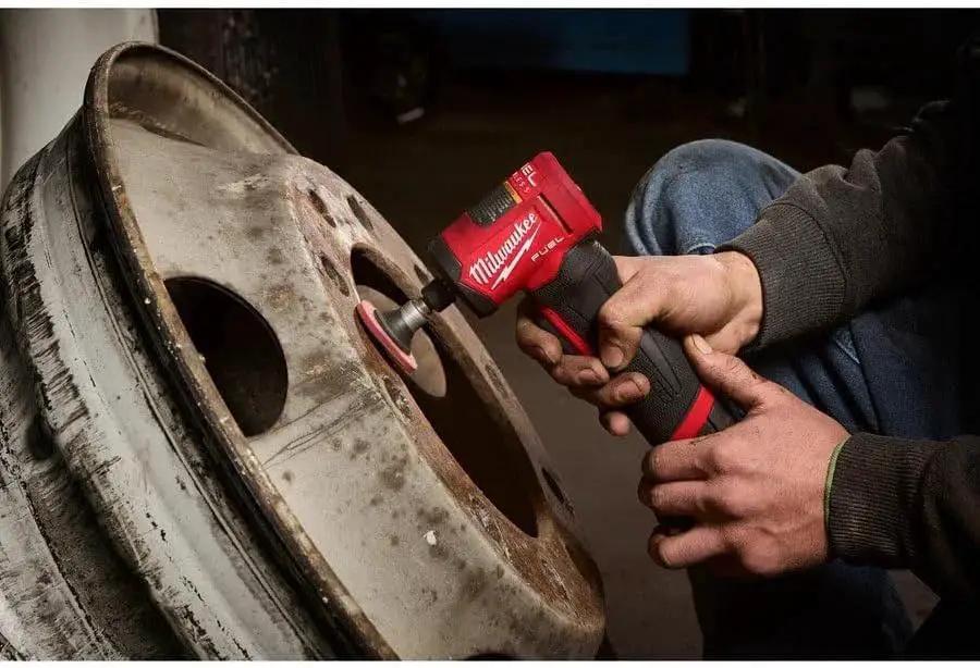 Right Angle Die Grinder M12 Fuel One Quarter Inch With Powerstate Brushless Motor, Shadowless LED Light in use for metal cleaning