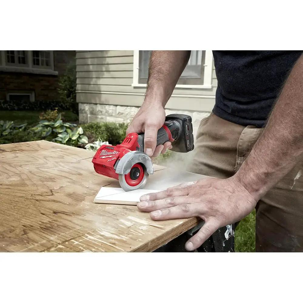 Person using Compact 12V Cut Off Tool Bare Tool With Reversible Blade Rotation, Powerstate Brushless Motor, Redlink Plus Intelligence For Overload Protection, And Ergonomic One Hand Grip For Precise Pro Grade Cuts Milwaukee on plywood