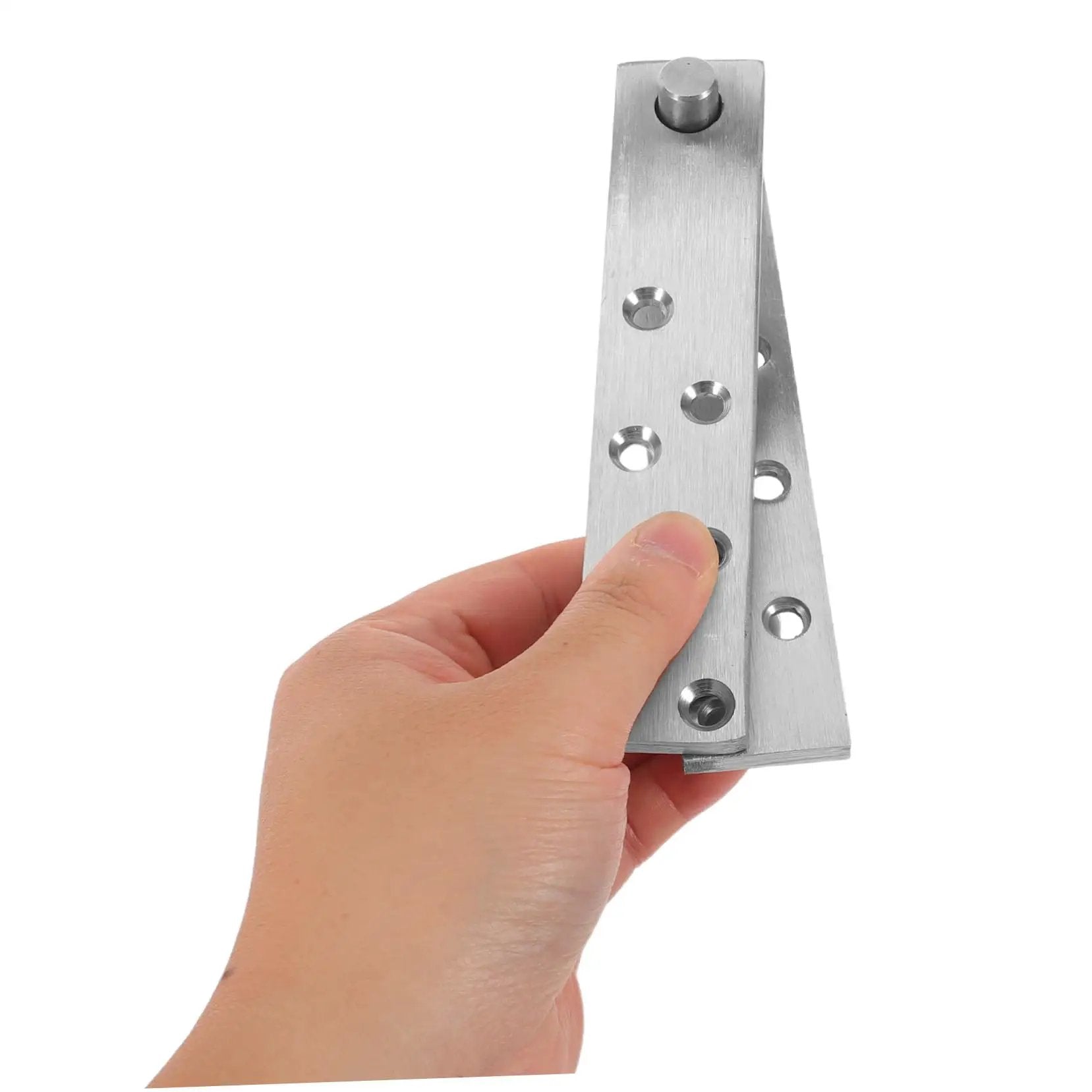 Hand holding Hideaway Heavy Duty Stainless Steel Hidden Door Pivot Hinges for solid wood doors, showcasing its sleek design.