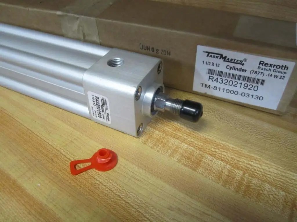 Rexroth Bosch TM-811000-03130 Pneumatic Cylinder with 12.5 inch stroke, 17 inch body length, and 2 inch bore on a workbench.