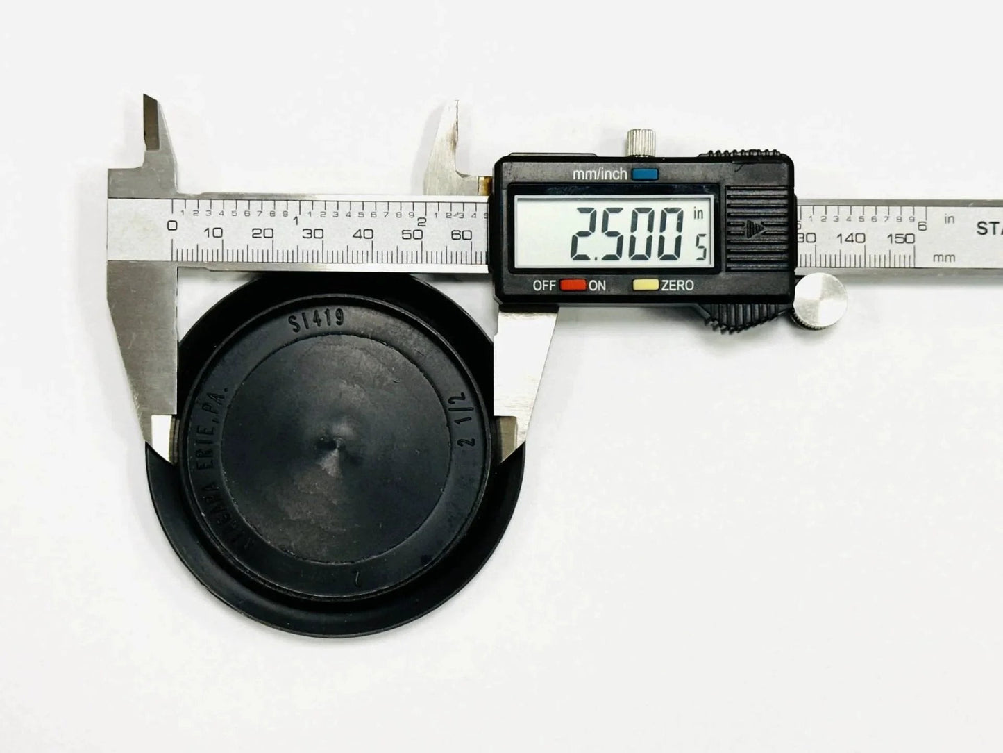 Caliper measuring Hole Size Two And A Half Inch Flush Mount Hole Plug In Black Plastic Body For Sheet Metal With A Three Inch Head Diameter